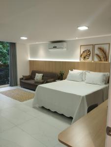 Cama ou camas em um quarto em Flat Beira-Mar Luxo - 113 Unity by Jess mais 12 fotos