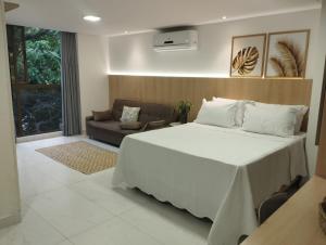 Cama ou camas em um quarto em Flat Beira-Mar Luxo - 113 Unity by Jess