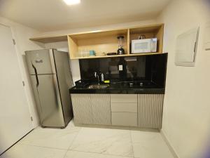 A cozinha ou cozinha compacta de Flat Beira-Mar Luxo - 113 Unity by Jess