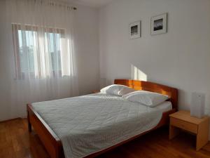 Posteľ alebo postele v izbe v ubytovaní Apartments Vlasici