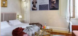 Postel nebo postele na pokoji v ubytování Art Hotel Orologio