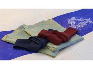 a pile of ties sitting on top of a bed at Hotel Sekisuien - Vacation STAY 44687v in Gujo