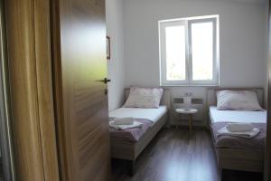 Postel nebo postele na pokoji v ubytování Apartments Sonne 2