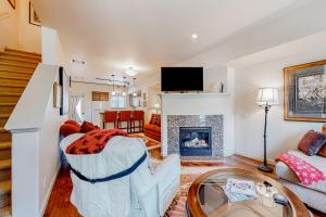 a living room with a couch and a fireplace at Sweet Retreat at Sweet Water in Hailey