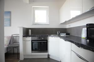 Kuchyň nebo kuchyňský kout v ubytování Apartments Sonne 2
