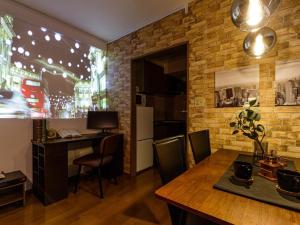 a kitchen and dining room with a brick wall at AirStay Horikiri 402 - Vacation STAY 45433v in Tokyo