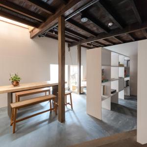 a kitchen with a wooden table and a bench at Ryokan Nishijin - Vacation STAY 46289v in Kyoto