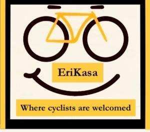 a sign with a bike on it that reads where cyclists are welcomed at Erikasa Riva della Torre Cormons in Cormòns