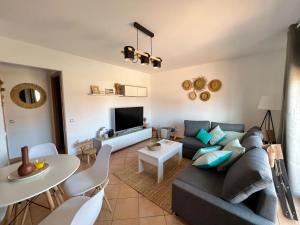 a living room with a couch and a table at Villa Aloe in Lajares