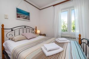 Posteľ alebo postele v izbe v ubytovaní Vacation house Anna