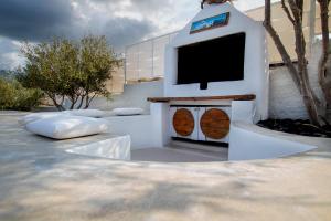 a small dog house with a flat screen tv on it at Sorocada Private House in Akrotiri