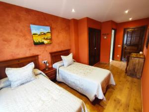 Cama o camas de una habitación en Hotel Rural Pajarapinta