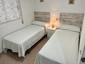 Łóżko lub łóżka w pokoju w obiekcie Alquileres Morasol - RECIÉN REFORMADO ZONA CENTRO