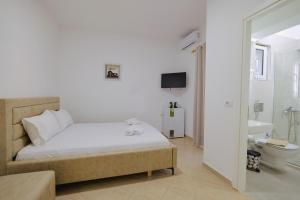 Ένα ή περισσότερα κρεβάτια σε δωμάτιο στο Relaxing Escape Rooms