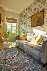 a living room with a couch and a table at The Villas at Spanish Court in Minden