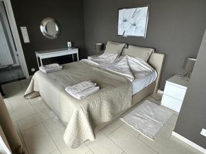 Postel nebo postele na pokoji v ubytování Schöne Ferienwohnung mit Aussicht auf den Zugersee