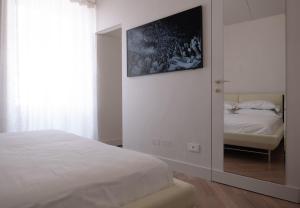 Postel nebo postele na pokoji v ubytování Palazzo Mazzini