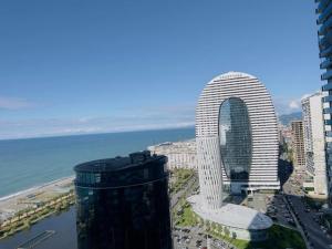 a view of a city with a tall building at #Orbi-city in Batumi