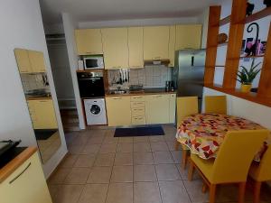 Kuchyň nebo kuchyňský kout v ubytování Sweet apartment Marijana