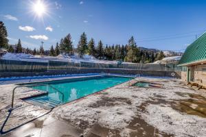 a swimming pool with snow on the ground at Tranquil Haven Retreat - DSTR1068 in Stateline