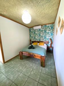 Ένα ή περισσότερα κρεβάτια σε δωμάτιο στο Cabinas Cahuita