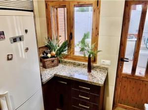 a bathroom with a sink and a window at Casa Merche in San José +49 photos