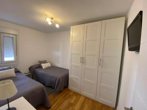 Posteľ alebo postele v izbe v ubytovaní Apartamento Arousa Mar