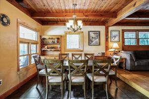 a dining room with a table and chairs at Falls Brook Camp in Stowe