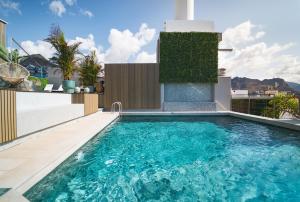 a swimming pool on the roof of a house at Hotel Taburiente S.C.Tenerife in Santa Cruz de Tenerife