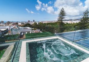 a swimming pool on the roof of a house at Hotel Taburiente S.C.Tenerife in Santa Cruz de Tenerife