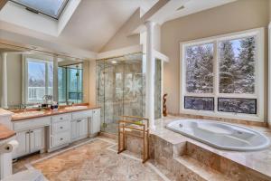 a bathroom with a large tub and a shower at Edson Hill Estate in Stowe