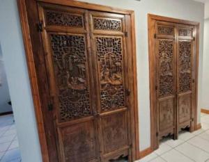 a pair of wooden doors in a room at Terra Organica in Courtenay