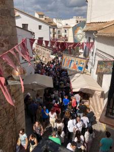 a crowd of people standing around in a street at Sagunto Castillo 17 in Sagunto