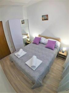 Ένα ή περισσότερα κρεβάτια σε δωμάτιο στο Apartman Tina