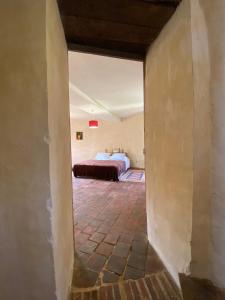 a view of a bedroom through a doorway at Tour du manoir de Boiscorde in Rémalard