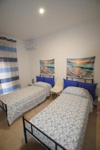 Postel nebo postele na pokoji v ubytování Casa Cinisi - Casa Vacanze