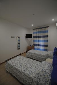 Postel nebo postele na pokoji v ubytování Casa Cinisi - Casa Vacanze