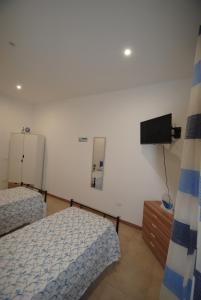 Postel nebo postele na pokoji v ubytování Casa Cinisi - Casa Vacanze