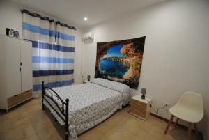 Postel nebo postele na pokoji v ubytování Casa Cinisi - Casa Vacanze