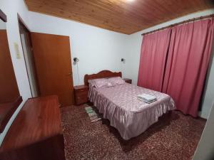 Tempat tidur dalam kamar di Casa quinta Los Girasoles