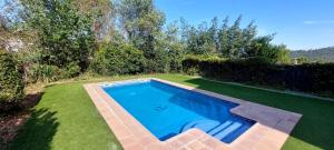 an overhead view of a swimming pool in a yard at Bravaholidays-601-Lloret Park 1 in Vidreres