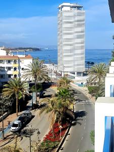 a view of a city street with a tall building at EsteponaCies in Estepona