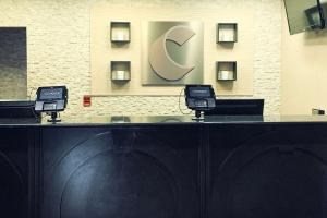 a black counter with two phones on top of it at Comfort Inn & Suites Atlanta-Smyrna in Atlanta