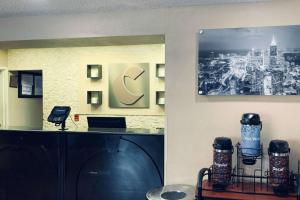a office with a reception desk and a picture of a city at Comfort Inn & Suites Atlanta-Smyrna in Atlanta