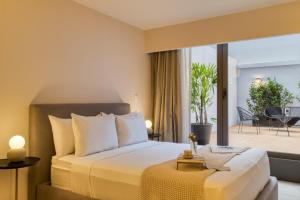 a hotel room with a bed and a balcony at ULIV Parque Lincoln in Mexico City