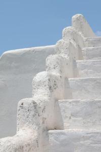 a white building with a bunch of concrete steps at Aegean traditional home in Athens Riviera in Sounio