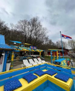 a water park with a pool and a playground at Vila Ivona in Čačak