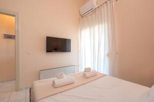 Postel nebo postele na pokoji v ubytování hespéra Summer House