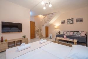 Postel nebo postele na pokoji v ubytování hespéra Summer House