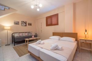 Postel nebo postele na pokoji v ubytování hespéra Summer House